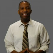 Smiling man in a dress shirt and tie